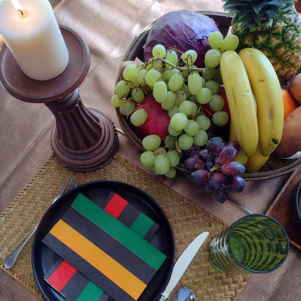 Kwanzaa table setting. 6 plates, 6 glasses, 24 napkins. Colorful and practical!